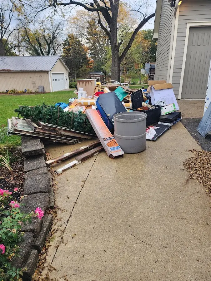 Dumpster being loaded with debris for Commercial Dumpster Rental in West Haverstraw